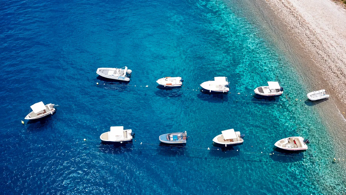 Group sailing in clear water